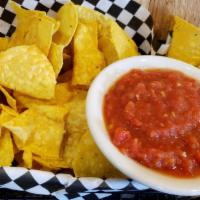 Chips & Salsa · A basket of hand fried tortilla chips served with pop's homemade salsa.