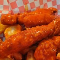 Buffalo Tenders · Fried chicken tenders tossed in buffalo sauce with your choice of ranch or bleu cheese.