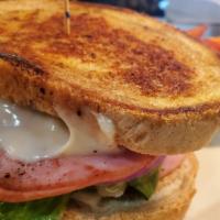 Grilled Ham & Swiss · Sliced ham grilled & served on toasted rye with melted Swiss cheese, lettuce & tomato