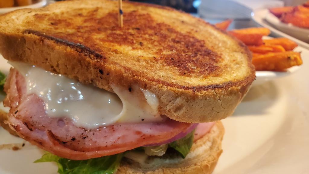 Grilled Ham & Swiss · Sliced ham grilled & served on toasted rye with melted Swiss cheese, lettuce & tomato