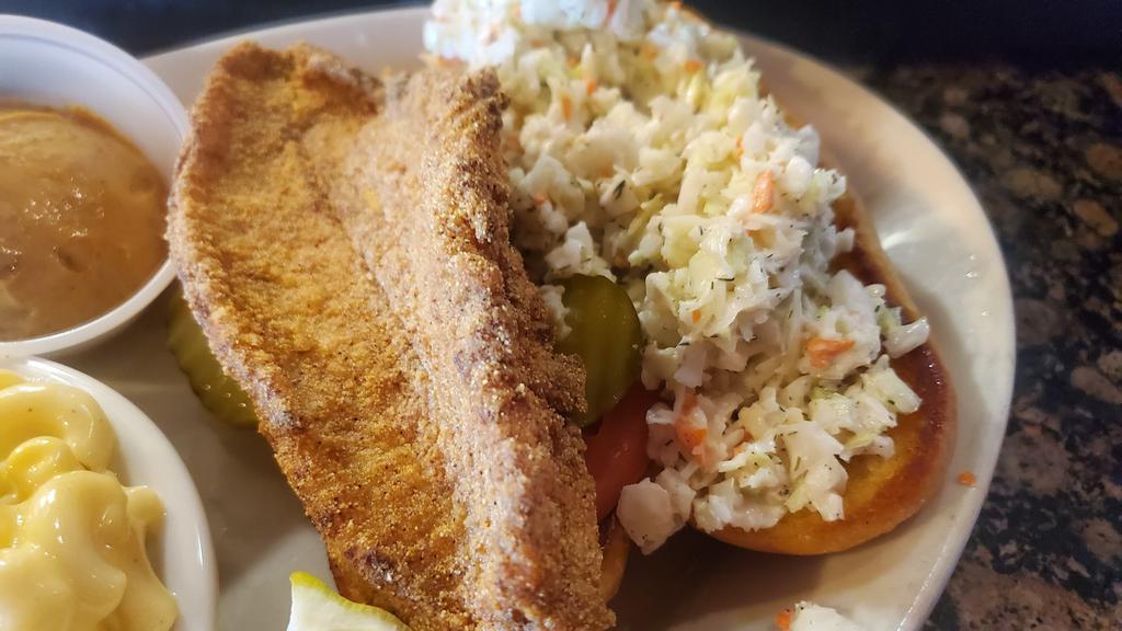 Catfish Hoagie · Catfish filet grilled or fried, served on a toasted hoagie with pickle, tomato, our homemade slaw & chipotle aioli