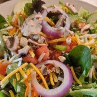 Mom'S Garden Salad · Mix of fresh greens topped with tomatoes, sliced cucumber, mushrooms, red onion, carrots, sh...