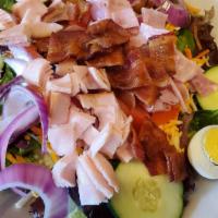 Chef Salad · Mixed greens topped with diced smoked turkey breast, smoked ham, crisp bacon, shredded carro...