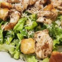 Chicken Caesar Salad · Grilled chicken breast served on a bed of romaine lettuce with parmesan cheese & croutons