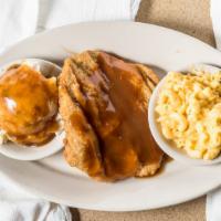 Country Fried Steak · A southern favorite golden fried steak with your choice of white or brown gravy and two sides.