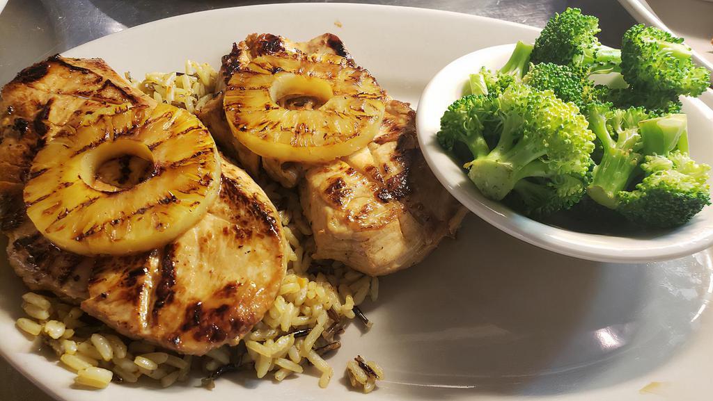 Hawaiian Grilled Chicken (2 Pc) · Grilled chicken breast marinated in pineapple juice, soy sauce, sherry, and spices; topped with grilled pineapple and served over rice pilaf with choice of one side.
