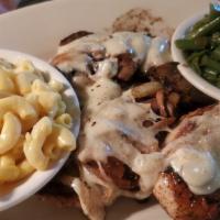 Smothered Chicken · Three grilled chicken tenderloins smothered with sauteed onions & mushrooms and provolone ch...