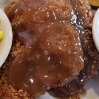 Saturday Only: Pork Chops · Two grilled or fried pork chops served with gravy & two sides
