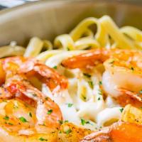 Napoli Alfredo Fettuccine Pasta · Fettuccine pasta with grilled Cajun shrimp or chicken and our Alfredo sauce on top with Parm...