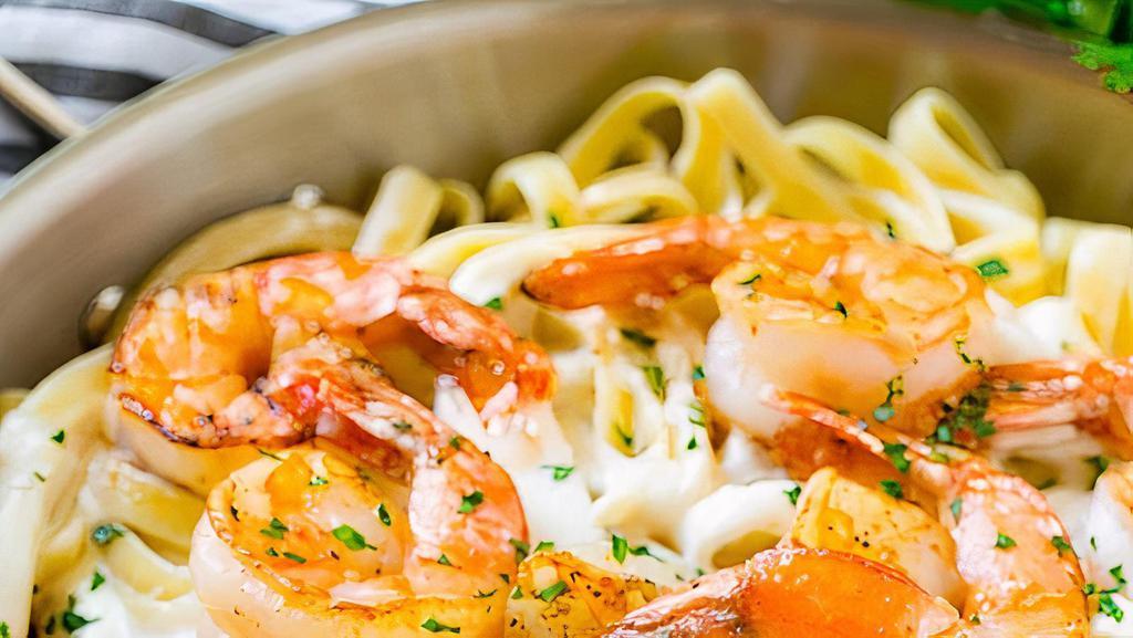 Napoli Alfredo Fettuccine Pasta · Fettuccine pasta with grilled Cajun shrimp or chicken and our Alfredo sauce on top with Parmesan and Roman and feta spring on top.