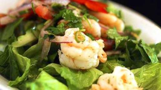 Yum Kung (Shrimp Salad) · GLUTEN-FREE.  Slightly Spicy. Shrimp mixed with cucumbers, onions, tomatoes, mint, cilantro, scallions, chili powder, fish sauce and lemon juice. Served on a bed of romaine lettuce.