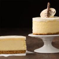 Cheesecake - Vanilla Bean  · Cheesecake flavored with real Madagascar vanilla beans.  The cheesecake sits on top of a gra...