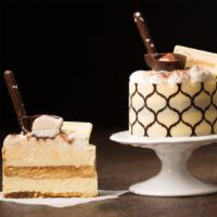 Mini Tiramisu Cake · Our Tiramisu cake has vanilla genoise soaked with coffee syrup, and layered with a light mas...