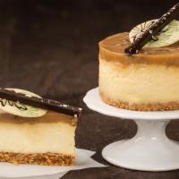 Cheesecake - Bourbon Caramel Pecan · A bourbon Cheesecake on a layer of graham cracker crust, topped with bourbon caramel pecan i...