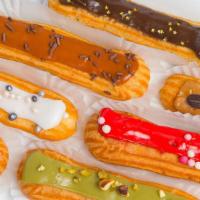 Eclairs - Box Of 6 · French Eclairs.  Cream filled pastry with flavored icing on top.

Please specify flavors.