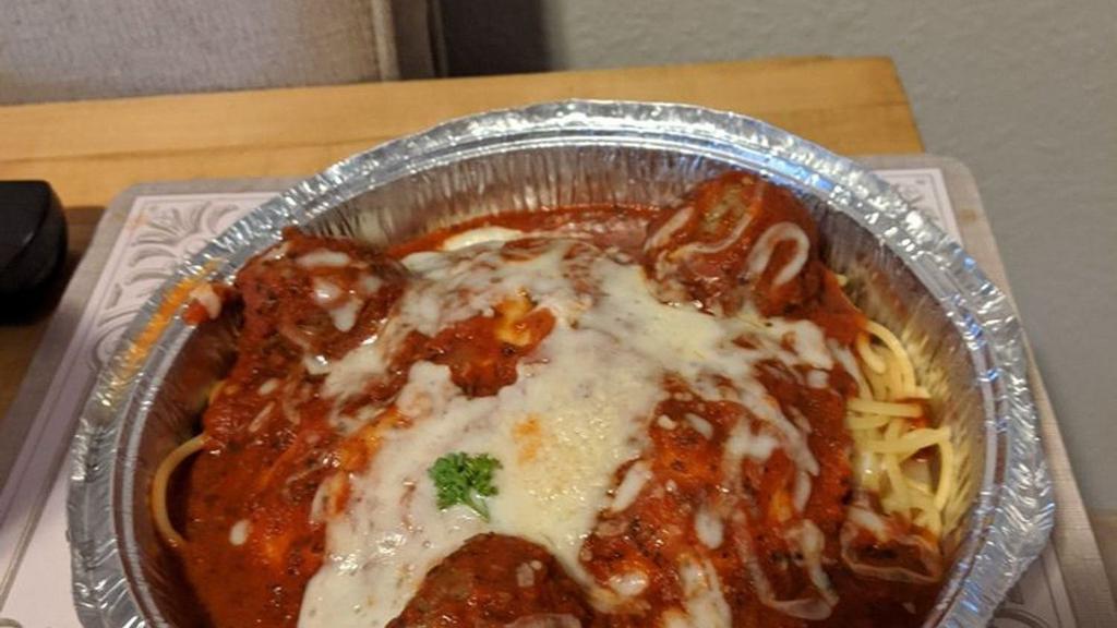Meat Ravioli · Ravioli stuffed with beef, spinach, romano and parmesan cheese and smothered in homemade pasta sauce. Baked under mozzarella cheese.