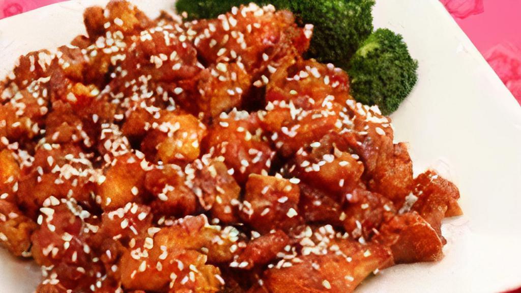 Sesame Chicken · Chunks of chicken stir fried with chefs sesame seed and hot garlic sauce. With white rice.