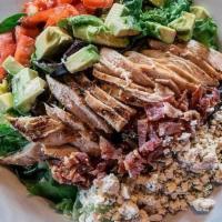 Cobb Salad · Grilled chicken, tomatoes, avocado, bacon and smoked gouda atop a bed of mixed greens.