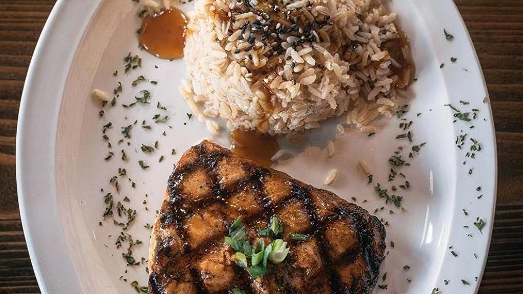 Grilled Salmon · Grilled salmon with teriyaki glaze served with rice & house salad.
