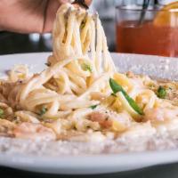 Pasta Lenora · Gulf shrimp sautéed in a rich alfredo sauce over linguini pasta.