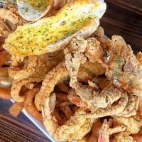Just Watch · (Feeds 2-3) A golden fried collage of shrimp, oysters, catfish & softshell crab on a bed of ...