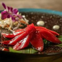 Tuna Tataki. · Tuna with tataki  sauce on top of seaweed salad