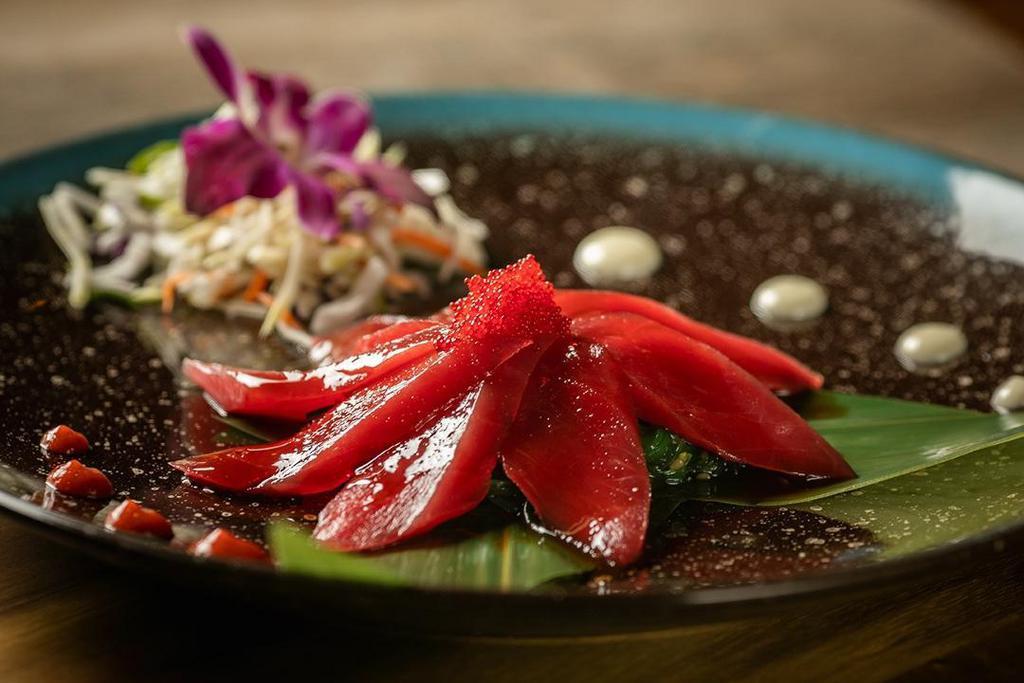 Tuna Tataki. · Tuna with tataki  sauce on top of seaweed salad