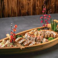Boat Combo #1. · Gyoza, King Crab, Iron Man, Volcano, Candy Cane. Served with 2 house salads.