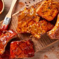 Baby Back Ribs · Our fall-off-the-bone ribs in the house-made sauce of your choice are served with a side of ...