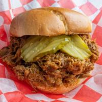 Roasted Pork Sandwich · Seasoned with house booty bun slow roasted melt in your mouth pork butt optional; dill pickl...