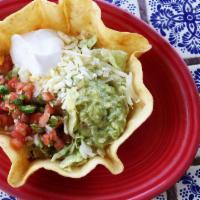 Taco Fajita Salad · Crispy taco bowl shell filled with your choice of chicken fajita or steak fajita topped with...