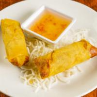 Spring Roll · Crispy house made rolls filled with pork, chicken, veggies, served with sweet chili fish sau...