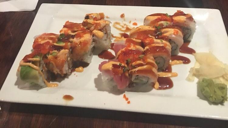 Buffalo Roll (8 Pcs) · Shrimp tempura, spicy mayo and avocado, wrapped in seared tuna, topped with wasabi yuzu dressing and scallions.