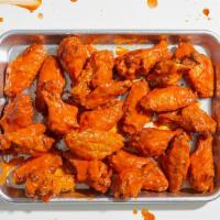 24 Buffalo Chicken Wings · Tossed with your choice of sauce and served with a side of ranch or blue cheese dressing.