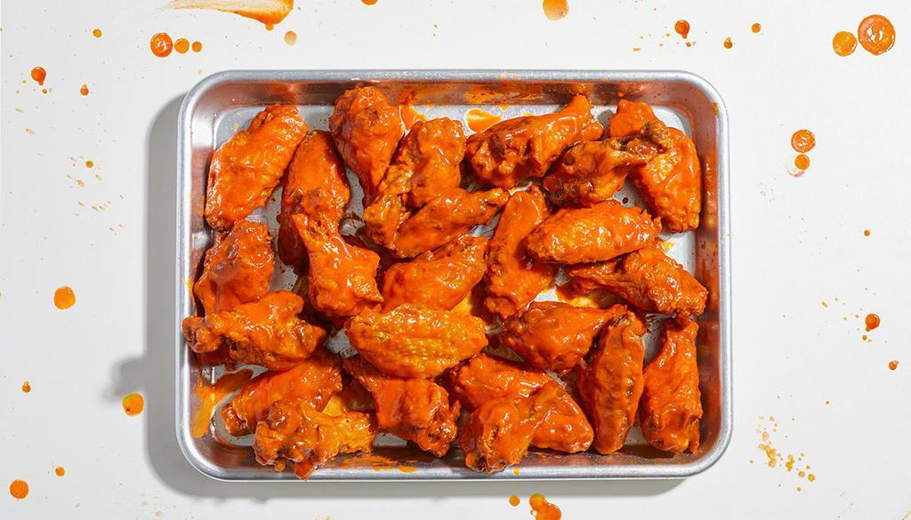 24 Piece Chicken Wings · 24 crispy chicken wings tossed in your choice of sauce. Served with ranch or blue cheese.