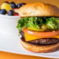 Beef Burger · Cheddar cheese, honey dijon mustard, mayo, and pickles on a brioche bun