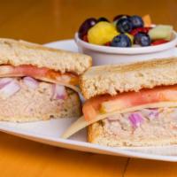 Tuna Melt · Tuna salad with melted Swiss cheese, tomatoes, and red onions toasted on country sourdough b...