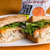 Pesto Chicken Salad · Pesto Chicken salad, lettuce, and tomatoes on toasted whole wheat bread. This item is served...