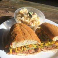Qc Pulled Pork · Wood-smoked pulled pork, our signature bbq sauce, pickles and honey mustard slaw on a fresh ...
