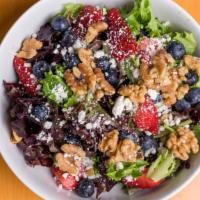 Red White & Blue · Organic field greens, fresh strawberries & blueberries, toasted walnuts, and goat cheese wit...