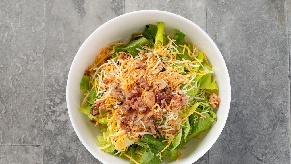 Cajun Crunch · Crisp romaine lettuce, Applewood smoked bacon, cheddar jack cheese, toasted pecans, and all natural freshly roasted Cajun chicken breast with honey mustard dressing