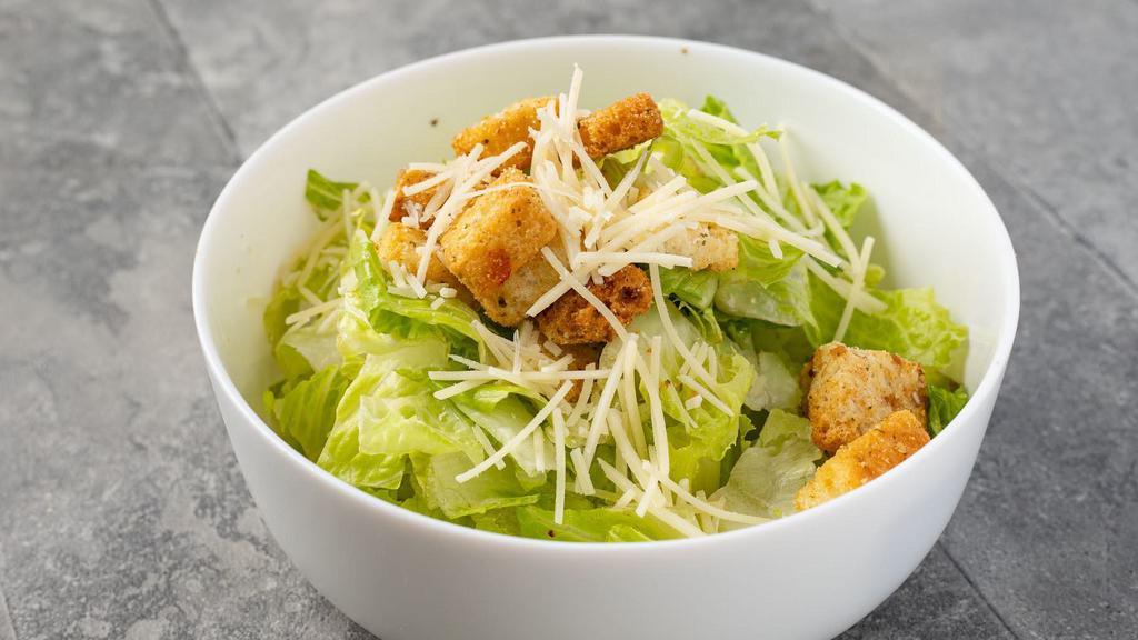 Classic Caesar · Crisp romaine lettuce topped with parmesan cheese and croutons with Caesar dressing