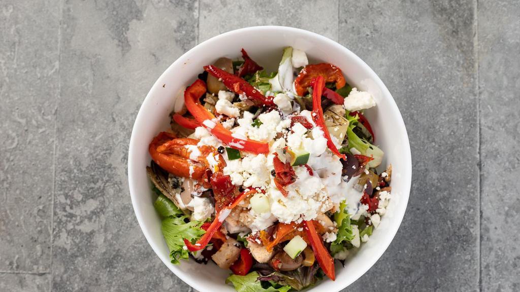The Greek · Organic field greens, roasted all-natural chicken breast, fire-roasted tomatoes, artichokes and red peppers, pickled red onions, olives and feta cheese, with garlic-feta vinaigrette and a tzatziki drizzle