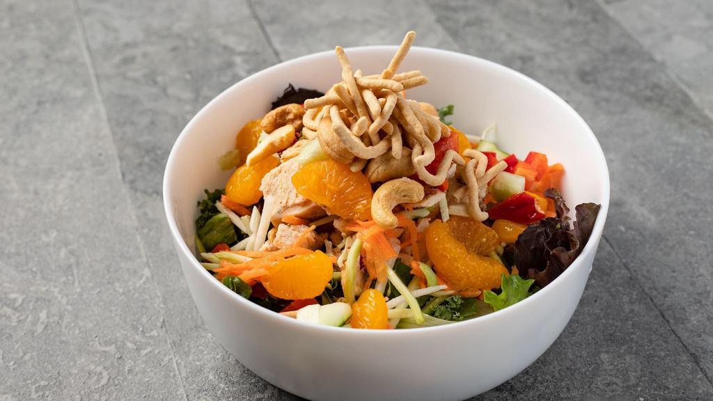 Asian Chicken Salad · Super greens, roasted all-natural chicken breast, carrots, mandarin oranges, cucumbers, red peppers, cilantro, cashews and crispy noodles with ginger-sesame dressing