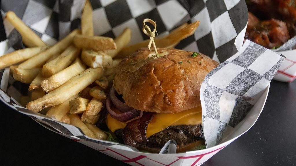 Bourbon Glaze Burger · House burger, slices of apple wood smoke bacon, grilled onions, cheddar cheese, topped with our signature bourbon glazed sauce.