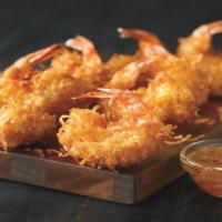 Gold Coast Coconut Shrimp** · Hand-dipped in batter, rolled in coconut and fried golden. Paired with Creole marmalade.