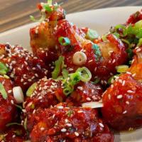 Gobi Manchurian · A fiery battered cauliflower cooked with onions, garlic and spices in a soy sauce