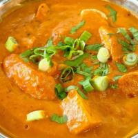 Butter Chicken · Boneless chicken (dark meat) cooked in creamy tomato, onion sauce with herbs and spices
