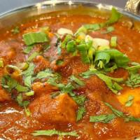 Chicken Curry · Boneless chicken gently simmered in onion, garlic, ginger and tomato sauce and a blend of In...