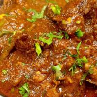 Goat Karahi · Goat meat cooked with fresh chopped onions, tomatoes, green chillies & spices